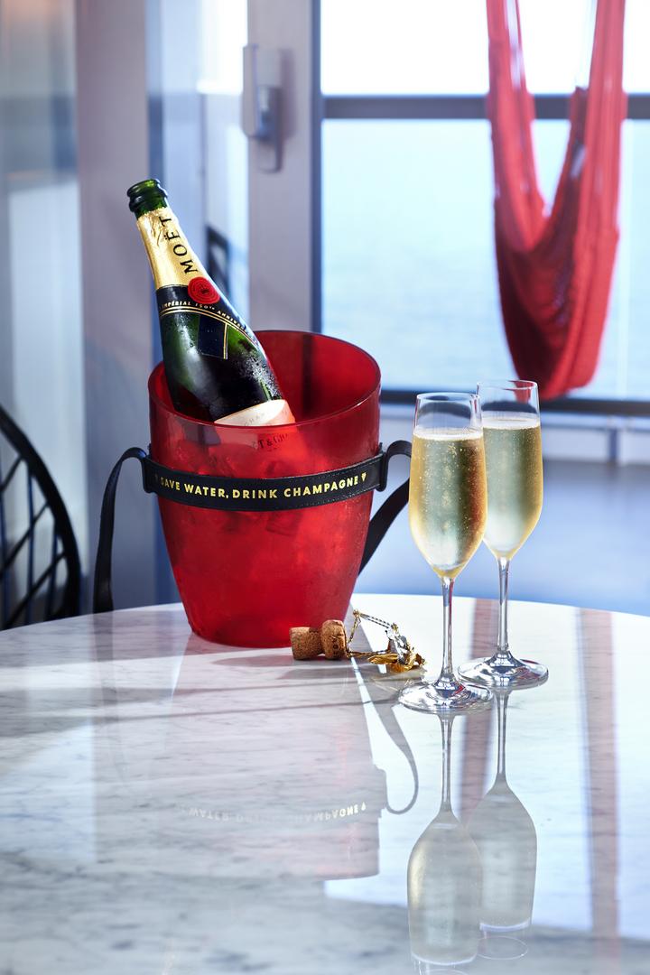 A bottle of Moet champagne in a bucket and two full glasses on a table in a suite, ordered through the Sailor App's Shake for Champagne feature. 
UK Photoshoot / Atlantis
Shoot Dates: Sept 27-30, 2021
Usage: Full Buyout
Goal: Food &amp; Beverages
Deliverables: Retouched images, gifs, and videos

TEAM
Photographer: Scott Grummett
https://www.scottgrummett.com
Agent: Terri Manduca
Food Stylist / AD: Elisa Merlo

CD: Christian Schrader
Art Buyer / Producer: Kathy Boos